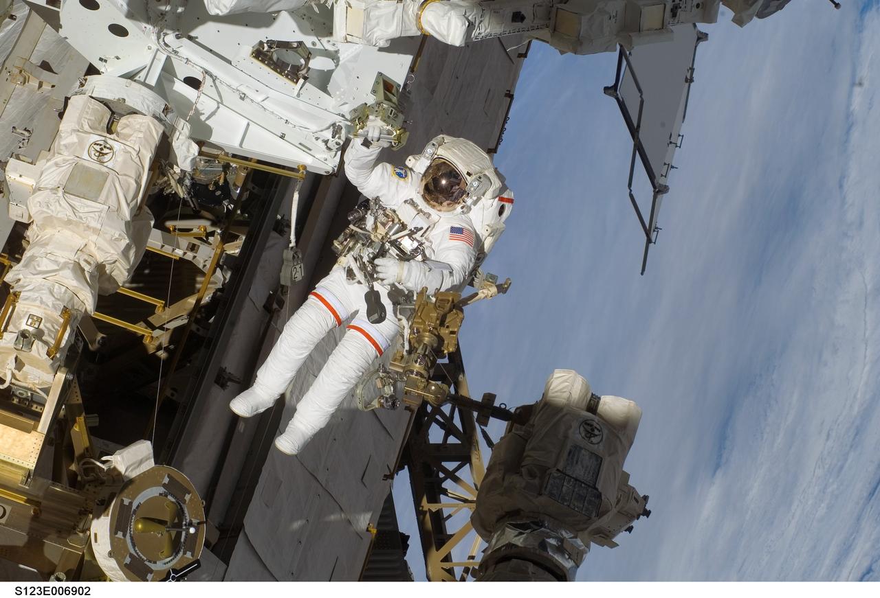 S123-E-006902 (17/18 March 2008) --- Astronaut Rick Linnehan, STS-123 mission specialist, participates in the mission's third scheduled session of extravehicular activity (EVA) as construction and maintenance continue on the International Space Station. During the 6-hour, 53-minute spacewalk, Linnehan and astronaut Robert L. Behnken (out of frame), mission specialist, installed a spare-parts platform and tool-handling assembly for Dextre, also known as the Special Purpose Dextrous Manipulator (SPDM). Among other tasks, they also checked out and calibrated Dextre's end effector and attached critical spare parts to an external stowage platform. The new robotic system is scheduled to be activated on a power and data grapple fixture located on the Destiny laboratory on flight day nine.