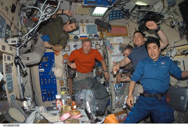 NASA image: STS-123 and Expedition 16 crewmembers in the SM during Joint Operations