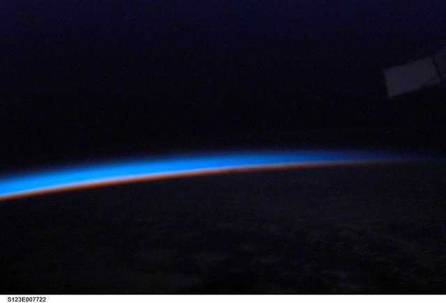 NASA image: Earth horizon by a STS-123 crewmember during Joint Operations