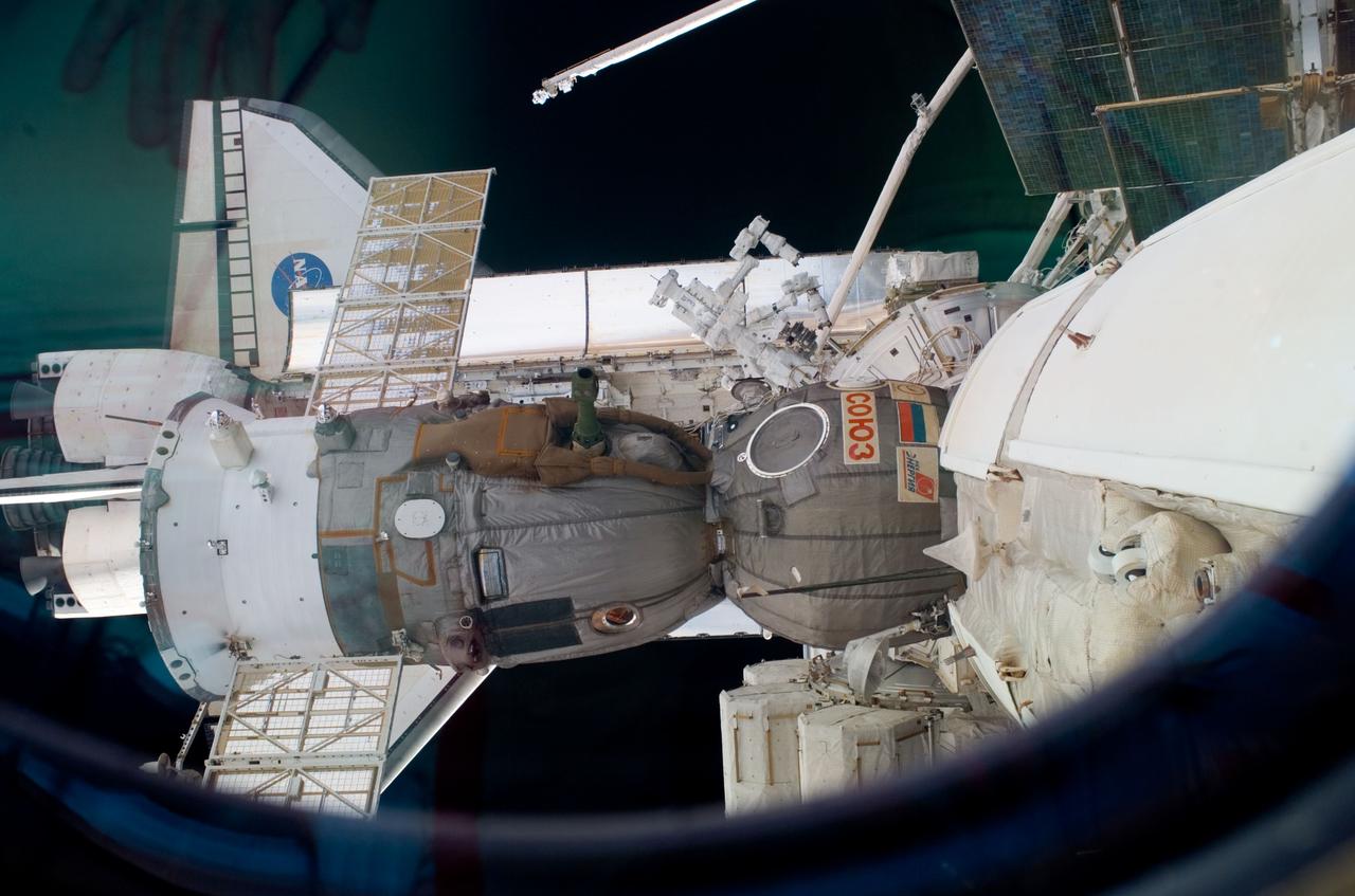 S123-E-008343 (21 March 2008) --- This scene, photographed from the International Space Station while docked with Space Shuttle Endeavour (STS-123), shows the orbiter, the shuttle's Remote Manipulator System/Orbiter Boom Sensor System (RMS/OBSS); Dextre, also known as the Special Purpose Dextrous Manipulator (SPDM); and a Soyuz vehicle docked with the orbital outpost.