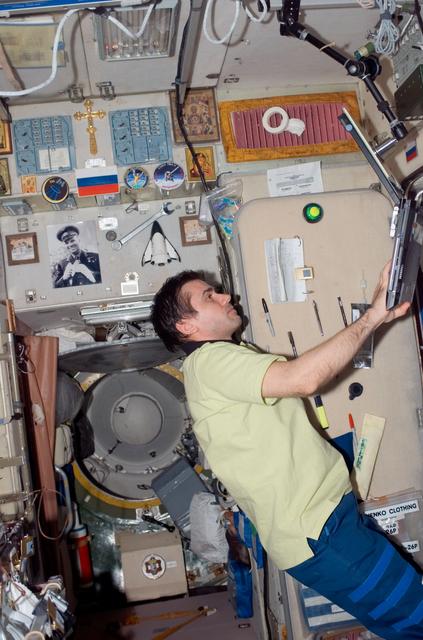 NASA image: Malenchenko uses a computer in the SM during Joint Operations