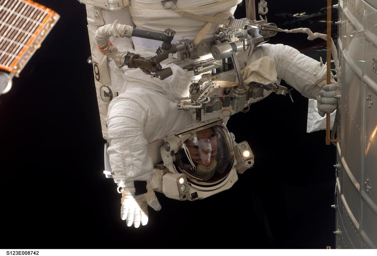 S123-E-008742 (22 March 2008) --- Astronaut Robert L. Behnken, STS-123 mission specialist, participates in the mission's fifth and final scheduled session of extravehicular activity (EVA) as construction and maintenance continue on the International Space Station. During the spacewalk, Behnken and astronaut Mike Foreman (out of frame), mission specialist, attached the shuttle's Orbiter Boom Sensor System (OBSS) to the S1 truss on the station, released launch locks on two of the Harmony module's common berthing mechanisms and install trunnion covers on the Japanese Logistics Module -- Pressurized Section. The spacewalkers also performed other tasks including an inspection of the starboard Solar Alpha Rotary Joint (SARJ) and installed the Materials International Space Station Experiment 6 (MISSE-6) on the outside of the European Space Agency's Columbus laboratory.