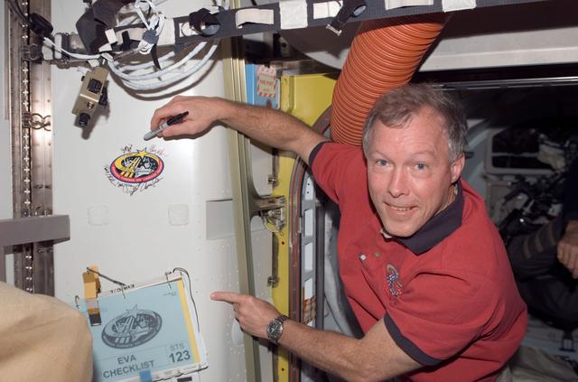 NASA image: Gorie signs STS-123 patch in the A/L during Joint Operations