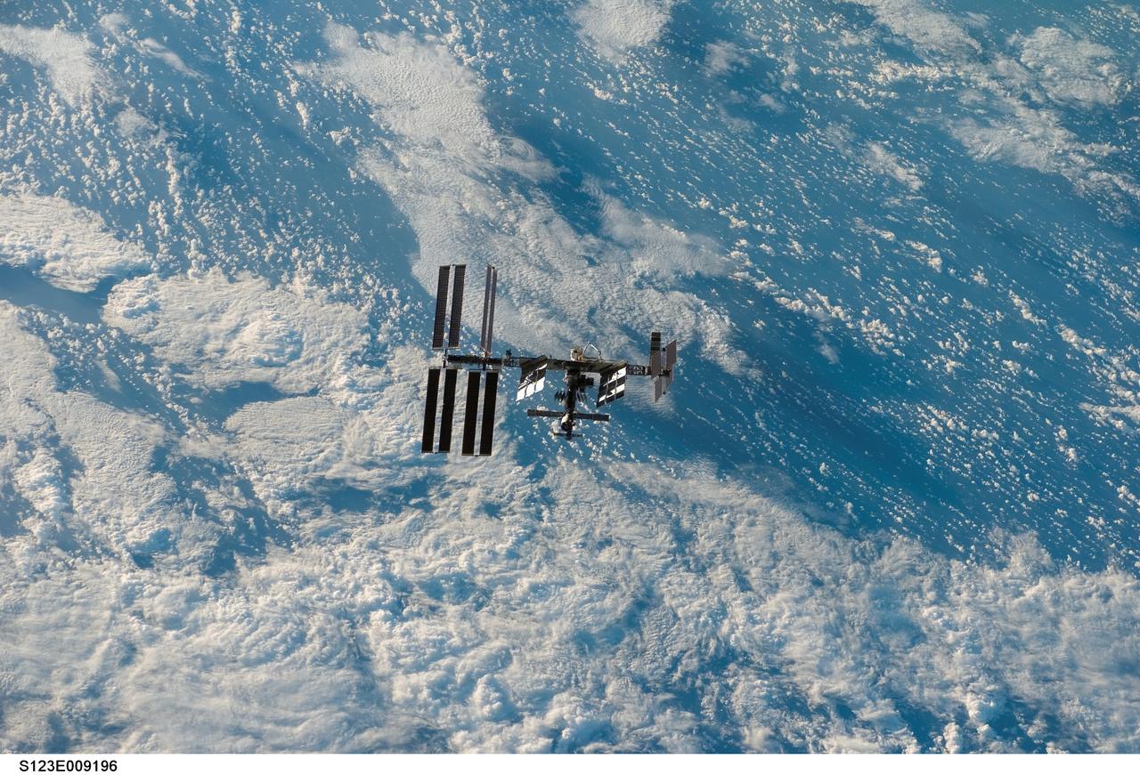 S123-E-009196 (24 March 2008) --- Backdropped by a blue and white part of Earth, the International Space Station is seen from Space Shuttle Endeavour as the two spacecraft begin their relative separation. Earlier the STS-123 and Expedition 16 crews concluded 12 days of cooperative work onboard the shuttle and station. Undocking of the two spacecraft occurred at 7:25 p.m. (CDT) on March 24, 2008.