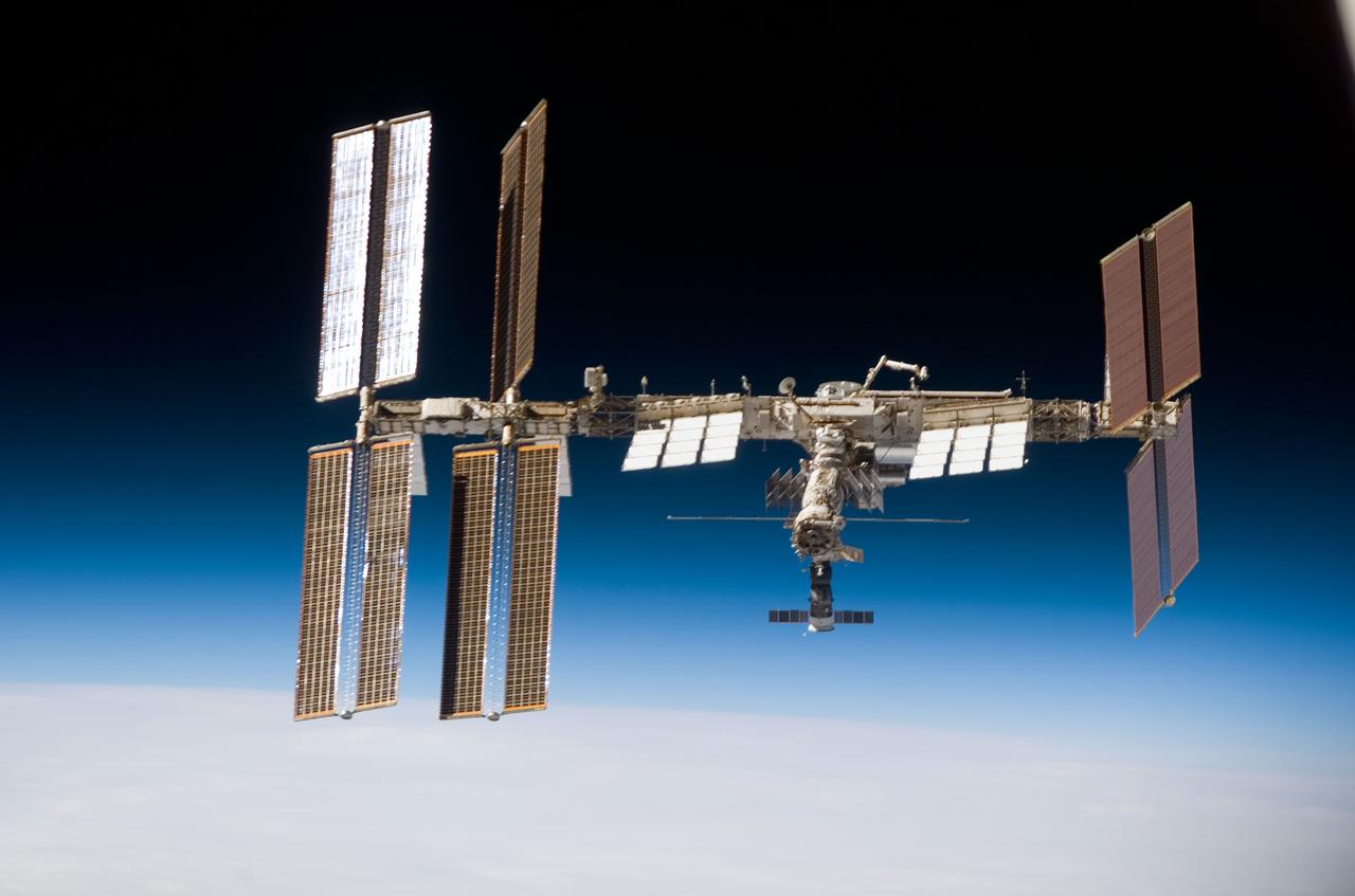 S123-E-009345 (24 March 2008) --- Backdropped by the airglow of Earth's horizon and the blackness of space, the International Space Station is seen from Space Shuttle Endeavour as the two spacecraft begin their relative separation. Earlier the STS-123 and Expedition 16 crews concluded 12 days of cooperative work onboard the shuttle and station. Undocking of the two spacecraft occurred at 7:25 p.m. (CDT) on March 24, 2008.