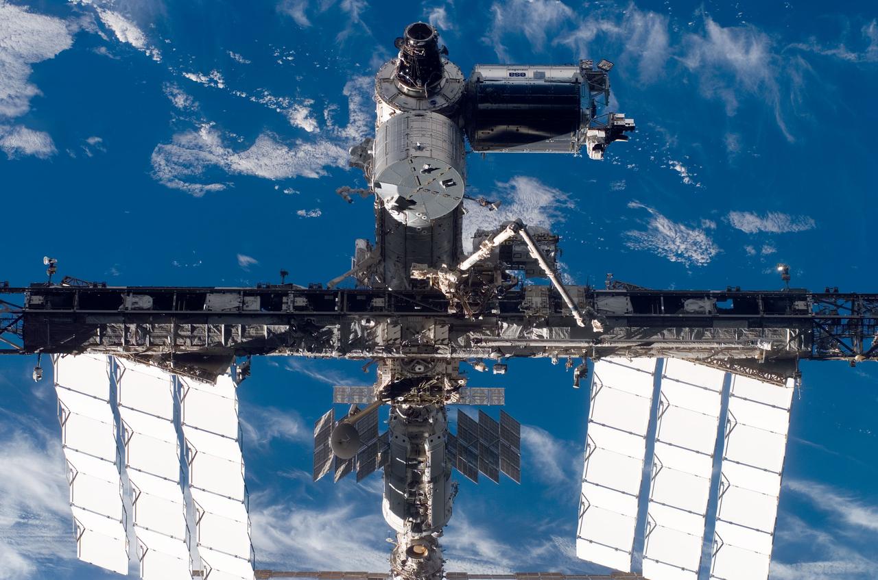 S123-E-010030 (24 March 2008) --- Backdropped by a blue and white part of Earth, a close-up view of the International Space Station is seen from Space Shuttle Endeavour as the two spacecraft begin their relative separation. The newly installed Japanese Logistics Module - Pressurized Section (JLP) is visible at top center. The JLP is the first pressurized component of the Japan Aerospace Exploration Agency's Kibo laboratory and the newest component of the station. Earlier the STS-123 and Expedition 16 crews concluded 12 days of cooperative work onboard the shuttle and station. Undocking of the two spacecraft occurred at 7:25 p.m. (CDT) on March 24, 2008.