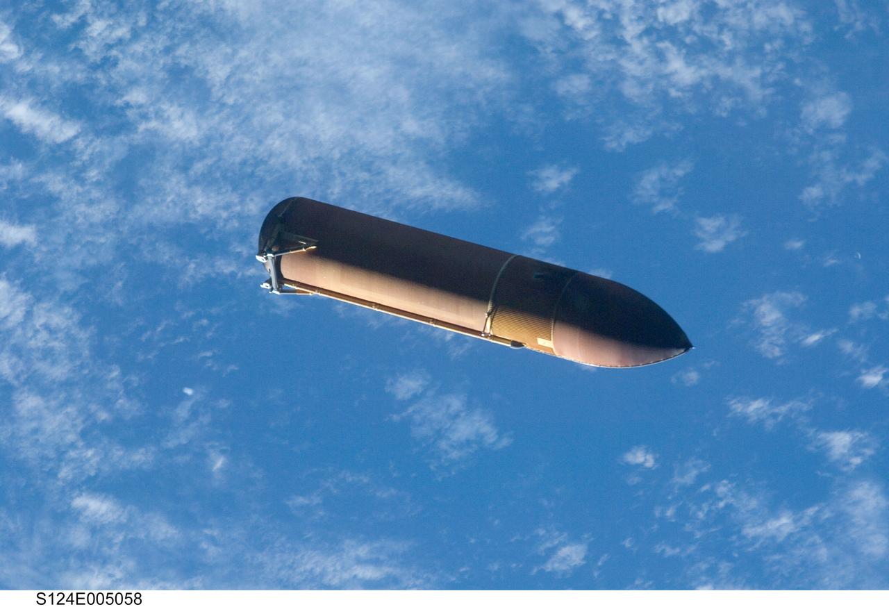 S124-E-005058 (31 May 2008) --- Backdropped by a blue and white part of Earth, the STS-124 external fuel tank (ET) begins its relative separation from the Space Shuttle Discovery. An STS-124 crewmember recorded the scene with a digital still camera.