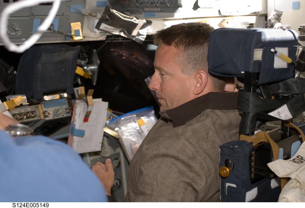 S124-E-005149 (1 June 2008) --- Astronaut Ken Ham, STS-124 pilot, works at the pilot's station on the forward flight deck of Space Shuttle Discovery during flight day two activities.