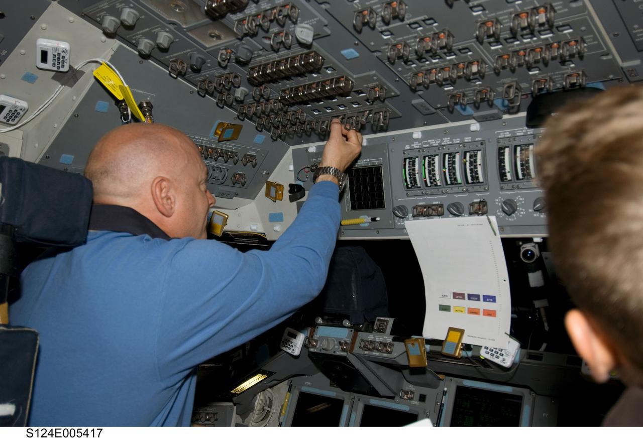 S124-E-005417 (1 June 2008) --- Astronaut Mark Kelly, STS-124 commander, works at the commander's station on the forward flight deck of Space Shuttle Discovery during flight day two activities.
