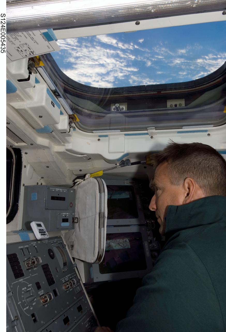 S124-E-005435 (1 June 2008) --- Astronaut Ken Ham, STS-124 pilot, works the controls on the aft flight deck of Space Shuttle Discovery during flight day two activities.