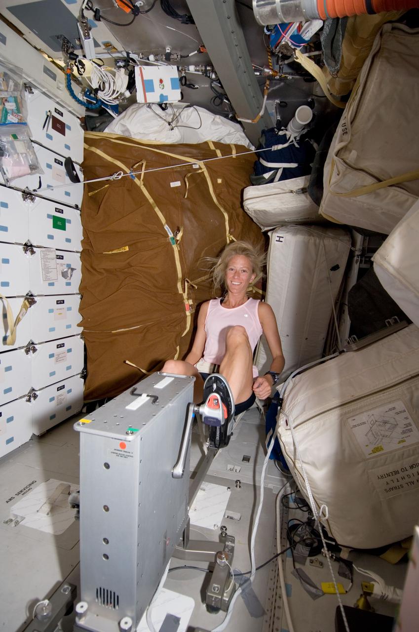 S124-E-005447 (1 June 2008) --- Astronaut Karen Nyberg, STS-124 mission specialist, exercises on the bicycle ergometer on the middeck of Space Shuttle Discovery.