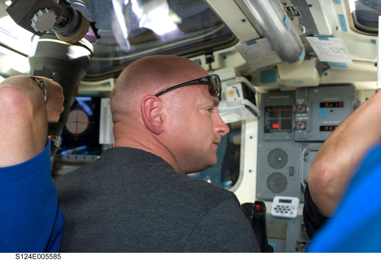 S124-E-005585 (2 June 2008) --- Astronaut Mark Kelly, STS-124 commander, works on the aft flight deck of Space Shuttle Discovery during flight day three activities.