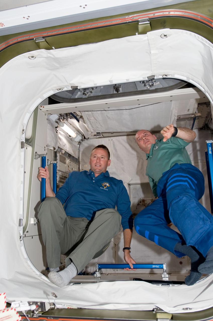 S124-E-005639 (2 June 2008) --- NASA astronauts Ken Ham (left), STS-124 pilot, and Garrett Reisman, Expedition 17 flight engineer, are pictured in the Japanese Logistics Module - Pressurized Section (JLP) of the International Space Station while Space Shuttle Discover is docked with the station.