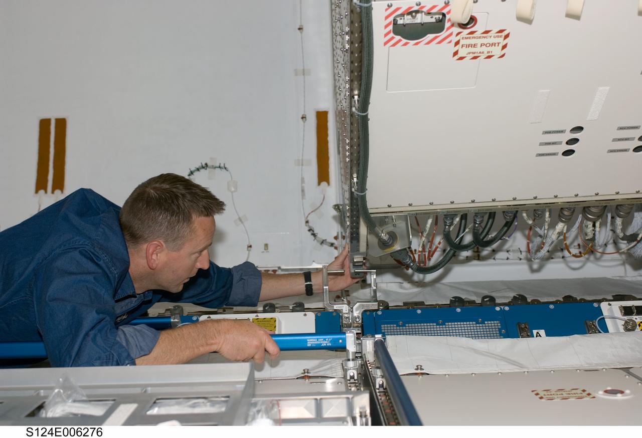 S124-E-006276 (4 June 2008) --- Astronaut Ken Ham, STS-124 pilot, works in the newly installed Kibo Japanese Pressurized Module (JPM) of the International Space Station while Space Shuttle Discovery is docked with the station.