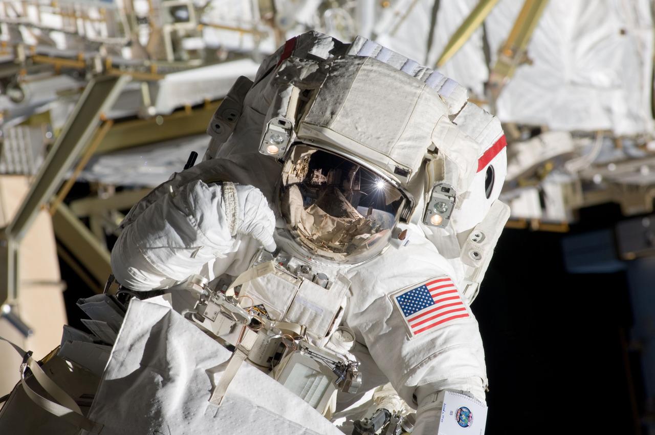 S124-E-006336 (5 June 2008) --- Astronaut Mike Fossum, STS-124 mission specialist, participates in the mission's second scheduled session of extravehicular activity (EVA) as construction and maintenance continue on the International Space Station. During the seven-hour, 11-minute spacewalk, Fossum and astronaut Ron Garan (out of frame), mission specialist, installed television cameras on the front and rear of the Kibo Japanese Pressurized Module (JPM) to assist Kibo robotic arm operations, removed thermal covers from the Kibo robotic arm, prepared an upper JPM docking port for flight day seven's attachment of the Kibo logistics module, readied a spare nitrogen tank assembly for its installation during the third spacewalk, retrieved a failed television camera from the Port 1 truss, and inspected the port Solar Alpha Rotary Joint (SARJ).