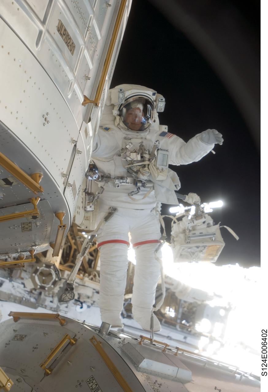 S124-E-006402 (5 June 2008) --- Astronaut Mike Fossum, STS-124 mission specialist, participates in the mission's second scheduled session of extravehicular activity (EVA) as construction and maintenance continue on the International Space Station. During the seven-hour, 11-minute spacewalk, Fossum and astronaut Ron Garan (out of frame), mission specialist, installed television cameras on the front and rear of the Kibo Japanese Pressurized Module (JPM) to assist Kibo robotic arm operations, removed thermal covers from the Kibo robotic arm, prepared an upper JPM docking port for flight day seven's attachment of the Kibo logistics module, readied a spare nitrogen tank assembly for its installation during the third spacewalk, retrieved a failed television camera from the Port 1 truss, and inspected the port Solar Alpha Rotary Joint (SARJ).
