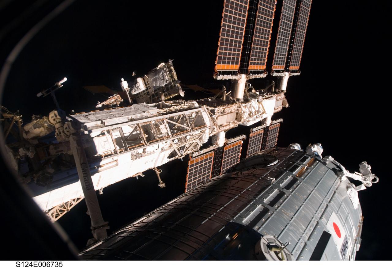 S124-E-006735 (6 June 2008) ---  One of a series of digital still images documenting the Japanese Experiment Module, or JEM, also called Kibo,  in its new home on the International Space Station, this view depicts Kibo's exterior, backdropped by solar array panels for the orbital outpost and one of its trusses.