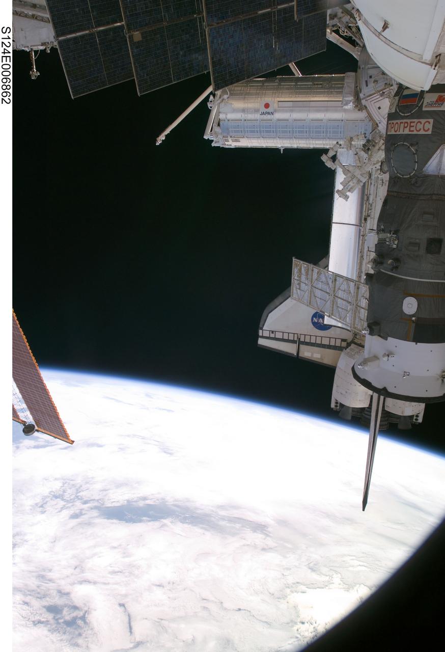 S124-E-006862 (6 June 2008) --- One of a series of digital still images documenting the Japanese Experiment Module, or JEM, also called Kibo, in its new home on the International Space Station, this view depicts Kibo's exterior in the distance, joined in the frame by some not so permanent hardware. The pictured components include the visiting Space Shuttle Discovery and a Russian Progress resupply vehicle.