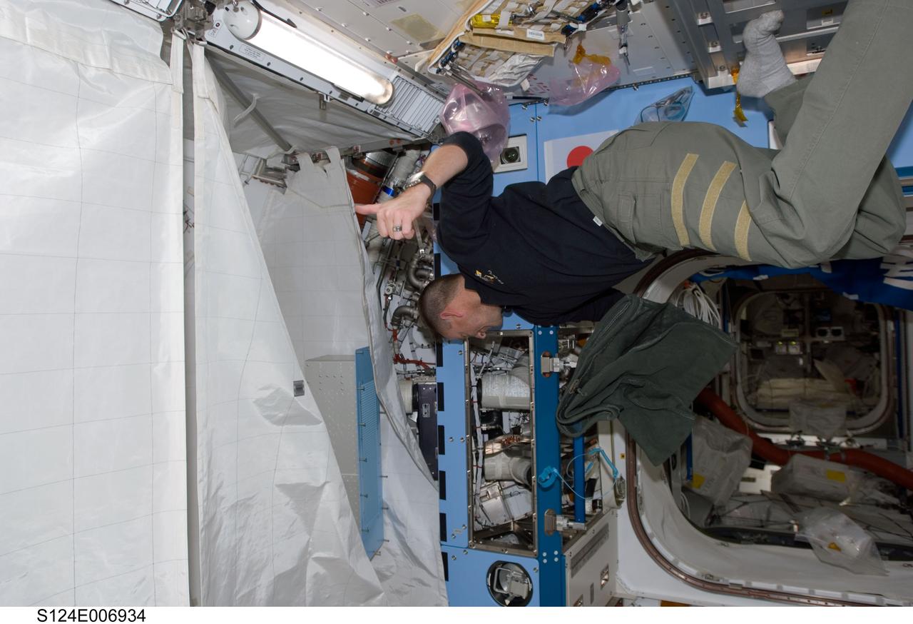 S124-E-006934 (6 June 2008) --- Astronaut Ken Ham, STS-124 pilot, works in the newly installed Kibo Japanese Pressurized Module while Space Shuttle Discovery is docked with the station.