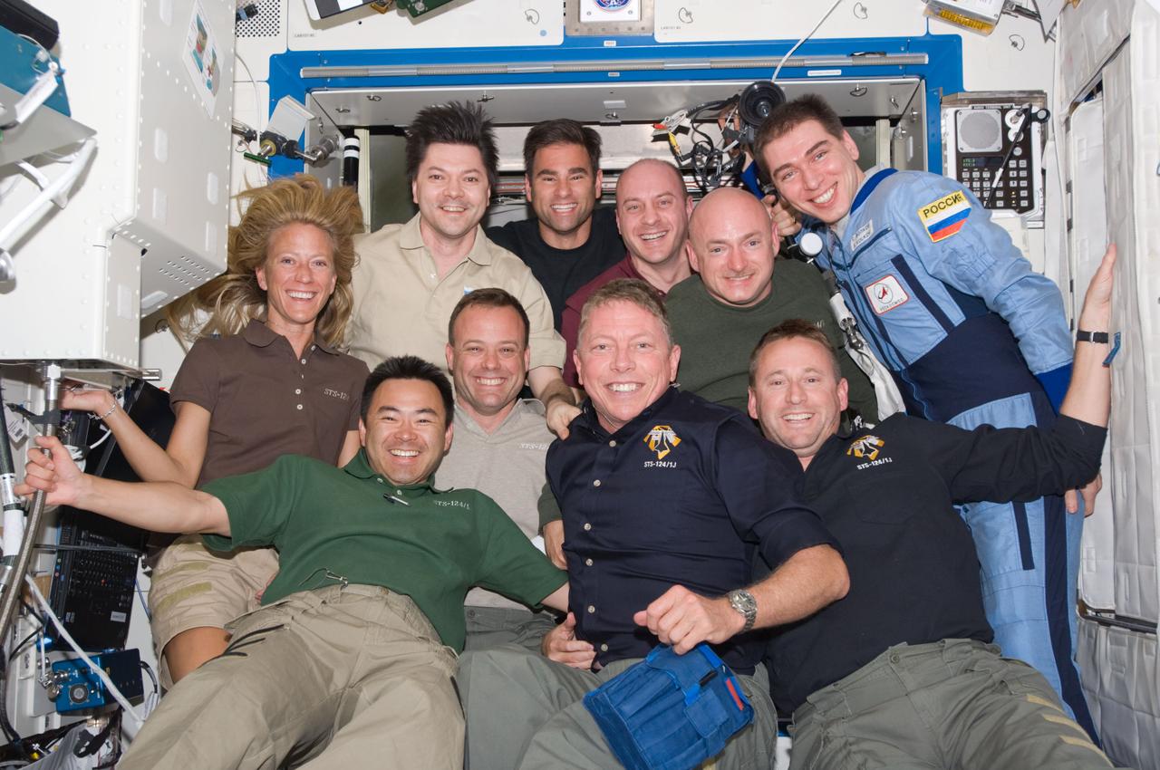 S124-E-007004 (6 June 2008) --- The STS-124 and Expedition 17 crewmembers pose for a group portrait in the Destiny laboratory of the International Space Station while Space Shuttle Discovery is docked with the station. From the left (front row) are NASA astronaut Karen Nyberg, Japan Aerospace Exploration Agency astronaut Akihiko Hoshide, NASA astronauts Ron Garan, Mike Fossum, all STS-124 mission specialists; and Ken Ham, STS-124 pilot. From the left (back row) are Russian Federal Space Agency cosmonaut Oleg Kononenko, NASA astronaut Greg Chamitoff, both Expedition 17 flight engineers; astronaut Garrett Reisman, STS-124 mission specialist; Mark Kelly, STS-124 commander; and Russian Federal Space Agency cosmonaut Sergei Volkov, Expedition 17 commander. Reisman, who joined the station's crew in March, is being replaced by Chamitoff, who arrived at the station with the STS-124 crew.