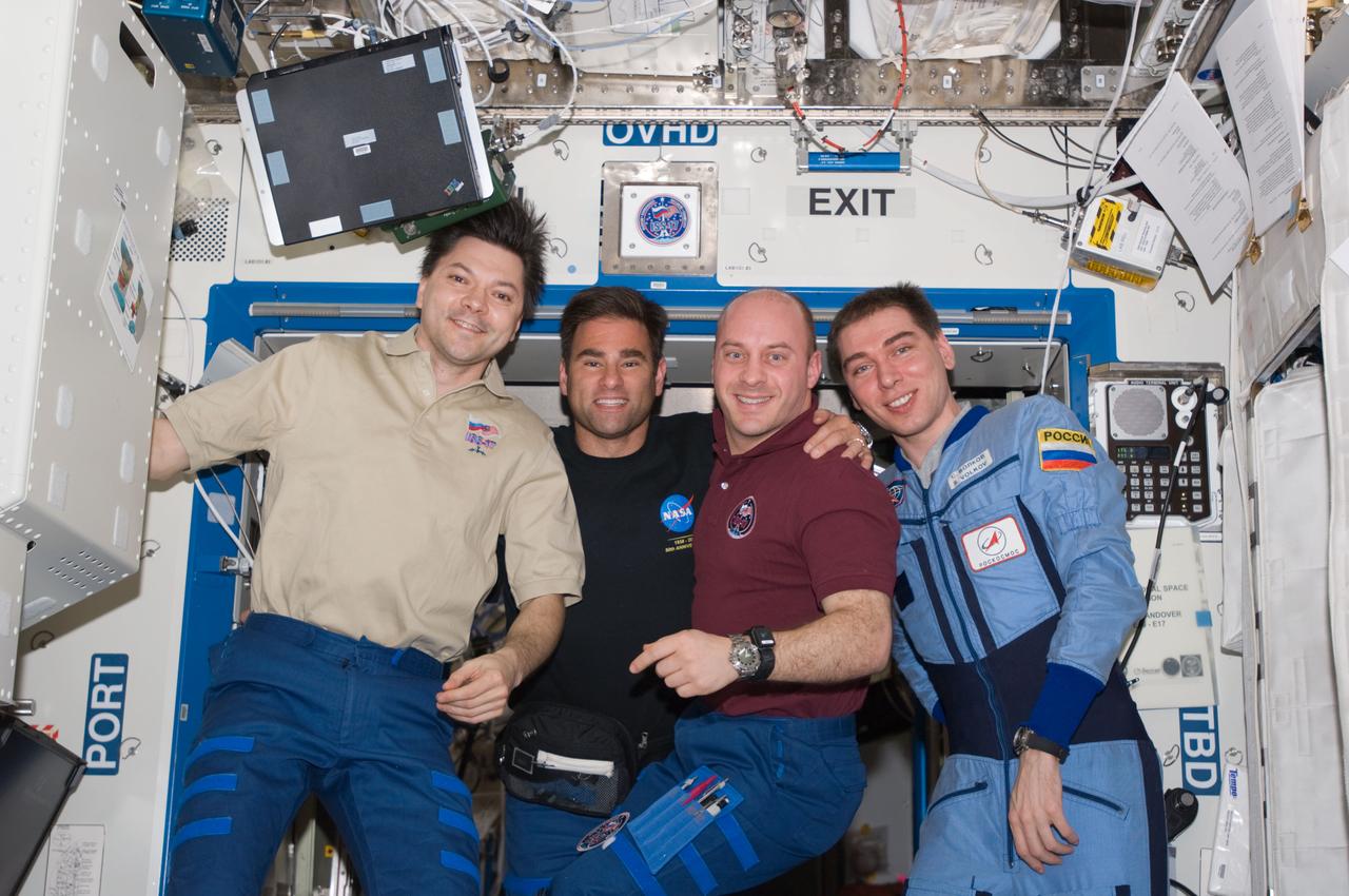S124-E-007005 (6 June 2008) --- Russian Federal Space Agency cosmonauts Sergei Volkov (right) and Oleg Kononenko (left), Expedition 17 commander and flight engineer, respectively; along with NASA astronauts Greg Chamitoff (second left), flight engineer, and Garrett Reisman, STS-124 mission specialist, pose for a photo in the Destiny laboratory of the International Space Station while Space Shuttle Discovery is docked with the station. Reisman, who joined the station's crew in March, is being replaced by Chamitoff, who arrived at the station with the STS-124 crew.