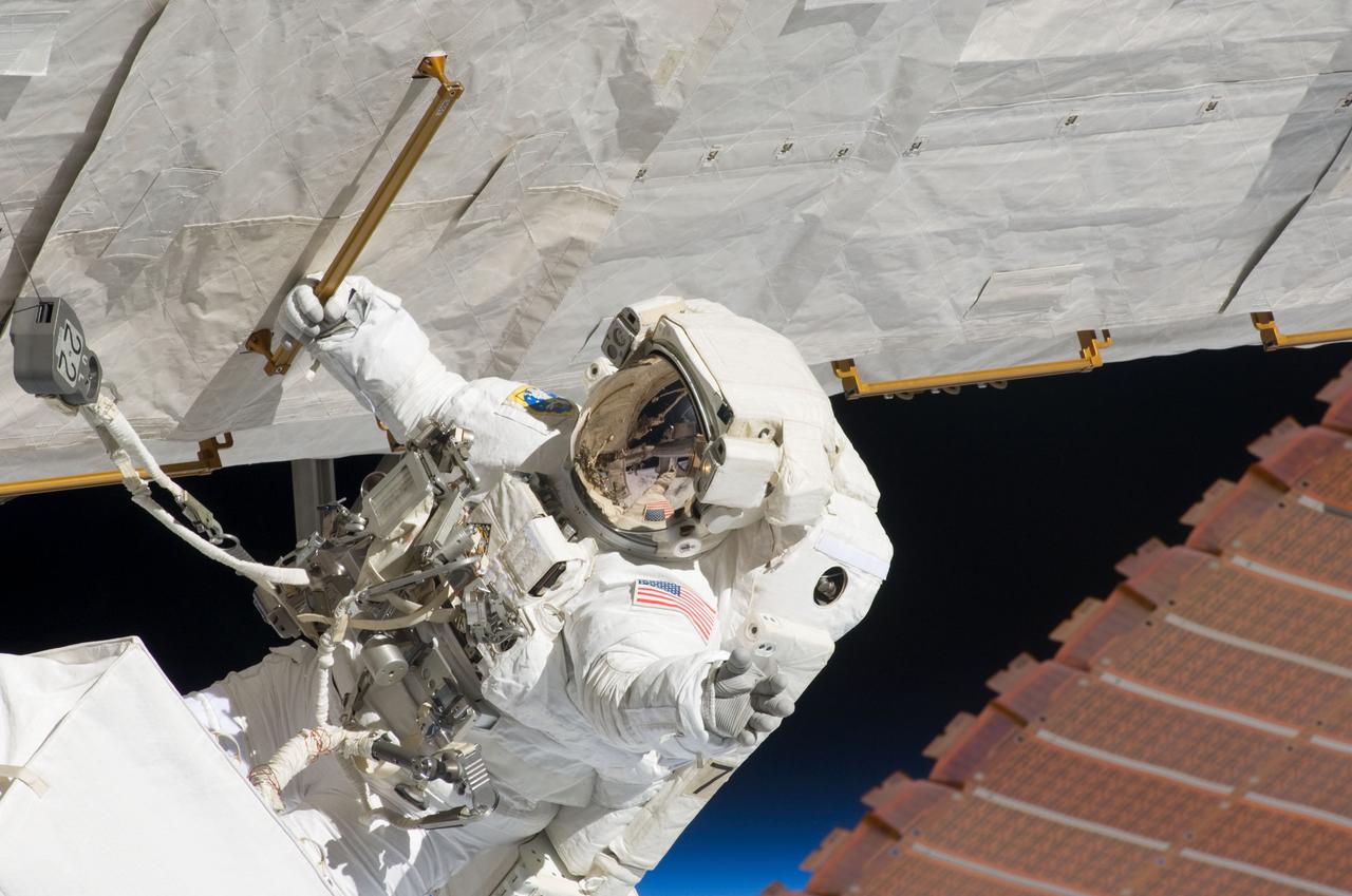 S124-E-007400 (8 June 2008) --- Astronaut Ron Garan, STS-124 mission specialist, participates in the mission's third scheduled session of extravehicular activity (EVA) as construction and maintenance continue on the International Space Station. During the six-hour, 33-minute spacewalk, Garan and astronaut Mike Fossum (out of frame), mission specialist, exchanged a depleted Nitrogen Tank Assembly for a new one, removed thermal covers and launch locks from the Kibo laboratory, reinstalled a repaired television camera onto the space station's left P1 truss, and retrieved samples of a dust-like substance from the left Solar Alpha Rotary Joint for analysis by experts on the ground.