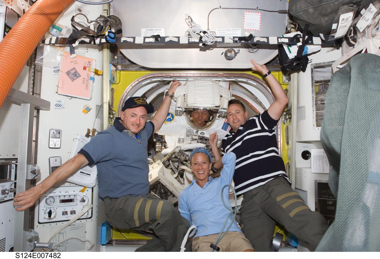 S124-E-007482 (8 June 2008) --- Astronauts Mark Kelly (left), STS-124 commander; Karen Nyberg, mission specialist; Ken Ham (right), pilot; and Mike Fossum, mission specialist, pose for a photo in the Quest Airlock of the International Space Station as the mission's third scheduled spacewalk draws to a close.