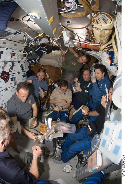 NASA image: STS-124 and ISS 17 crew on shuttle middeck