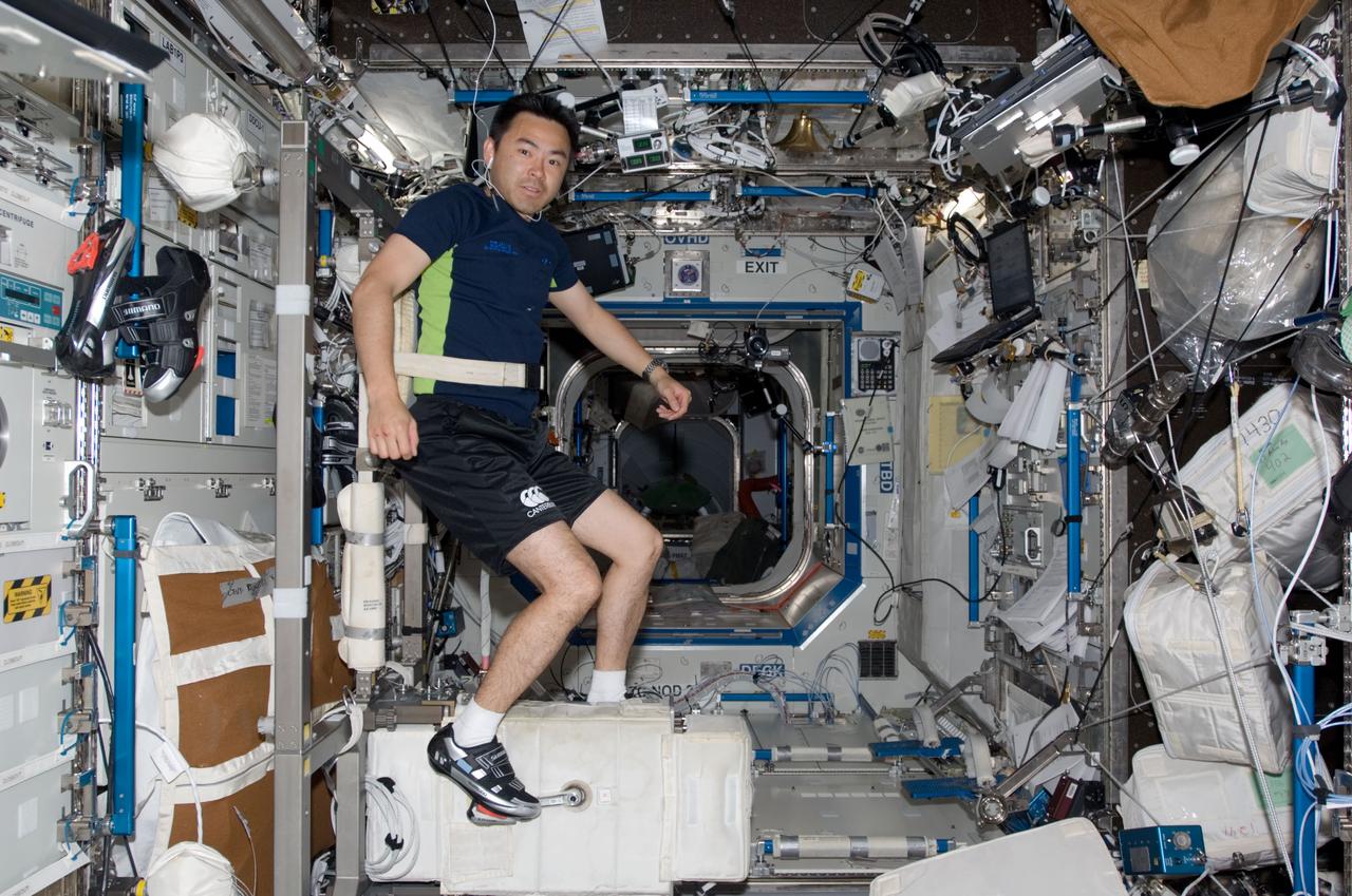 S124-E-007613 (7 June 2008) --- JAXA astronaut Akihiko Hoshide, STS-124 mission specialist, exercises on the Cycle Ergometer in the Destiny laboratory of the International Space Station.