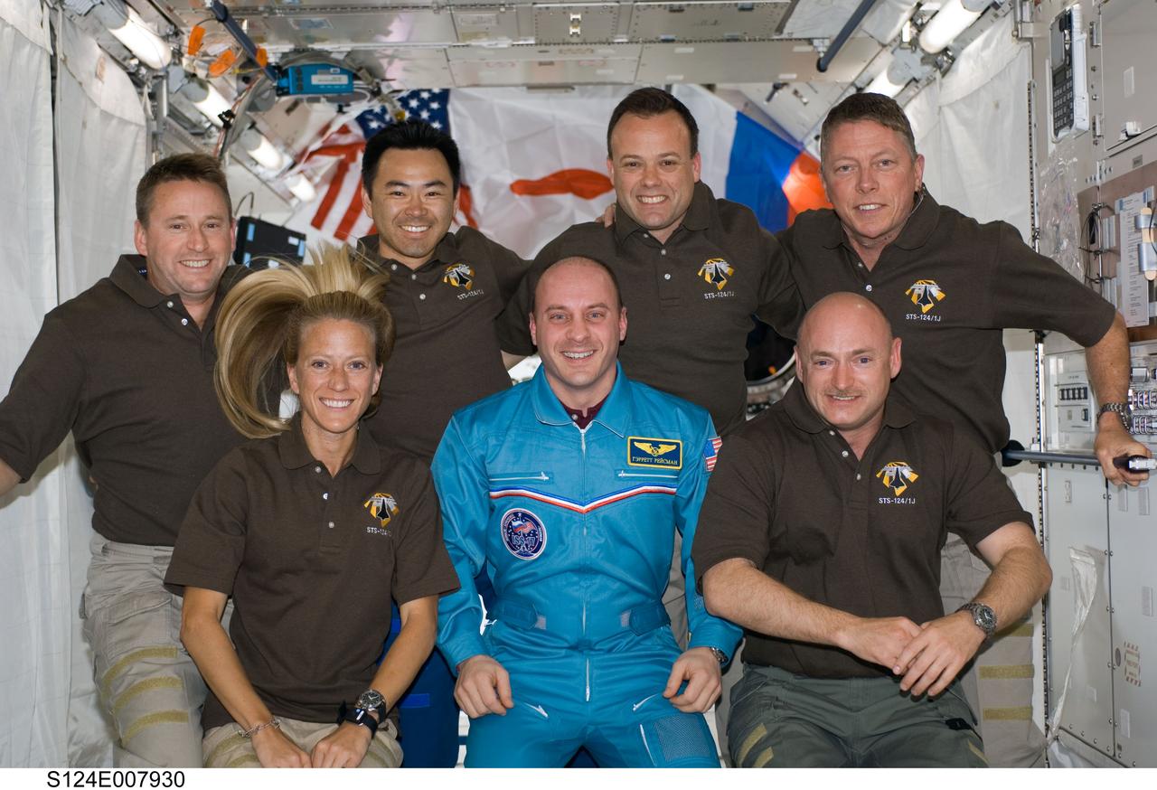 S124-E-007930 (9 June 2008) --- STS-124 crewmembers pose for a portrait following a joint news conference with the Expedition 17 crewmembers from the Kibo Japanese Pressurized Module of the International Space Station while Space Shuttle Discovery is docked with the station. From the left (front row) are NASA astronauts Karen Nyberg, Garrett Reisman, both mission specialists; and Mark Kelly, commander. From the left (back row) are NASA astronaut Ken Ham, pilot; Japan Aerospace Exploration Agency astronaut Akihiko Hoshide, NASA astronauts Ron Garan and Mike Fossum, all mission specialists. Reisman, who joined the station's crew in March, is being replaced by Chamitoff (not pictured), who arrived at the station with the STS-124 crew.
