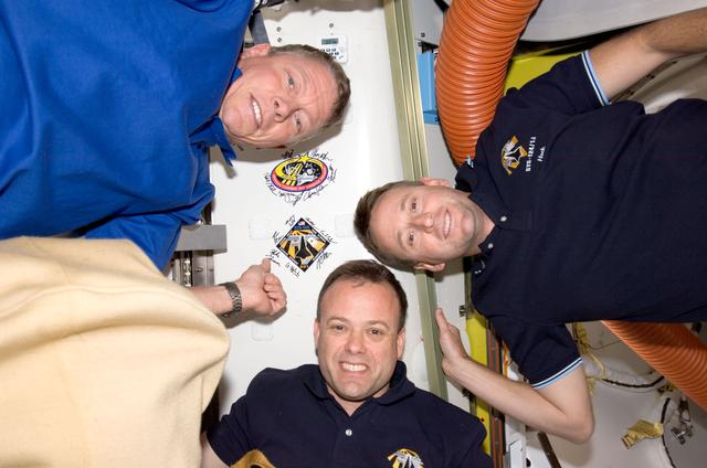 NASA image: Ham, Garan and Fossum with patches in Airlock