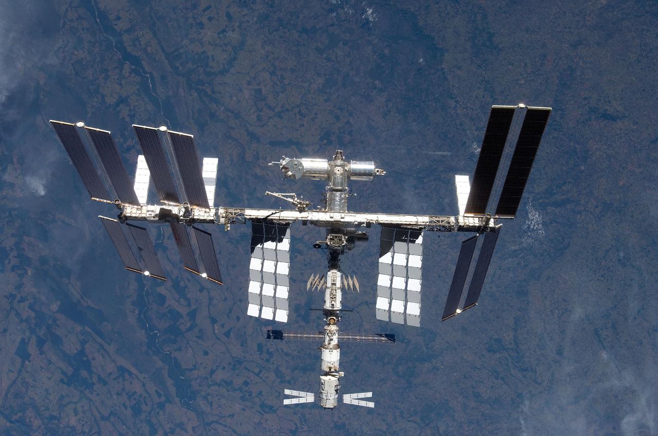 S124-E-009973 (11 June 2008) --- The International Space Station is seen from Space Shuttle Discovery as the two spacecraft begin their relative separation. Earlier the STS-124 and Expedition 17 crews concluded almost nine days of cooperative work onboard the shuttle and station. Undocking of the two spacecraft occurred at 6:42 a.m. (CDT) on June 11, 2008.