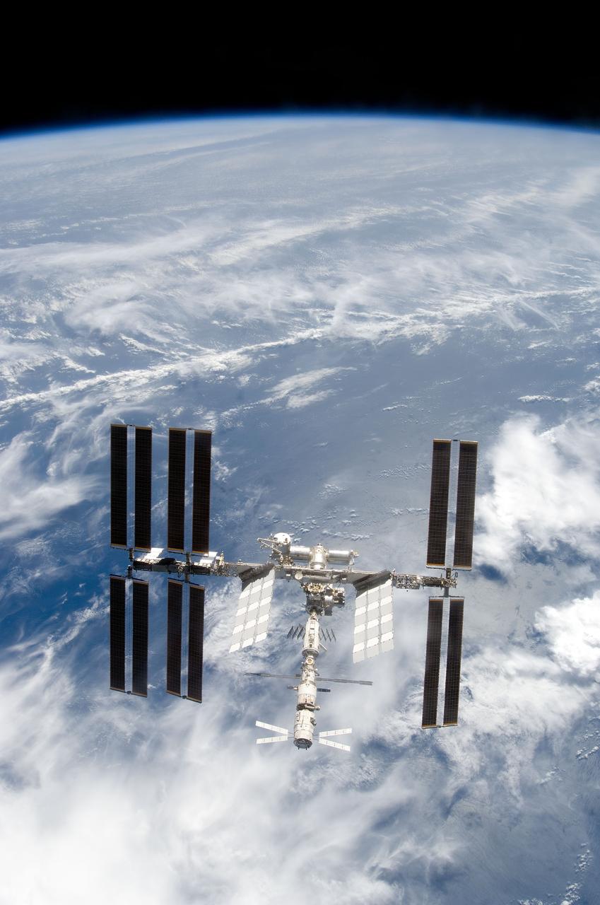 S124-E-009990 (11 June 2008) --- Backdropped by Earth's horizon and the blackness of space, the International Space Station is seen from Space Shuttle Discovery as the two spacecraft begin their relative separation. Earlier the STS-124 and Expedition 17 crews concluded almost nine days of cooperative work onboard the shuttle and station. Undocking of the two spacecraft occurred at 6:42 a.m. (CDT) on June 11, 2008.