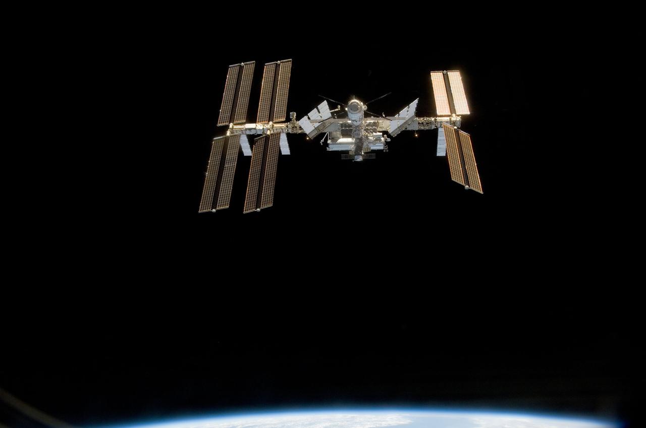 S124-E-010042 (11 June 2008) --- Backdropped by the blackness of space, the International Space Station is seen from Space Shuttle Discovery as the two spacecraft begin their relative separation. Earlier the STS-124 and Expedition 17 crews concluded almost nine days of cooperative work onboard the shuttle and station. Undocking of the two spacecraft occurred at 6:42 a.m. (CDT) on June 11, 2008.