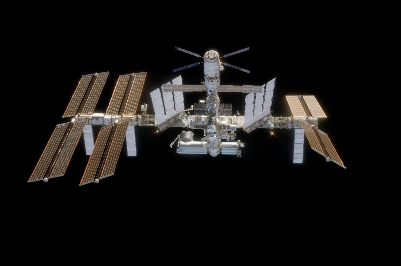 S124-E-010045 (11 June 2008) --- Backdropped by the blackness of space, the International Space Station is seen from Space Shuttle Discovery as the two spacecraft begin their relative separation. Earlier the STS-124 and Expedition 17 crews concluded almost nine days of cooperative work onboard the shuttle and station. Undocking of the two spacecraft occurred at 6:42 a.m. (CDT) on June 11, 2008.