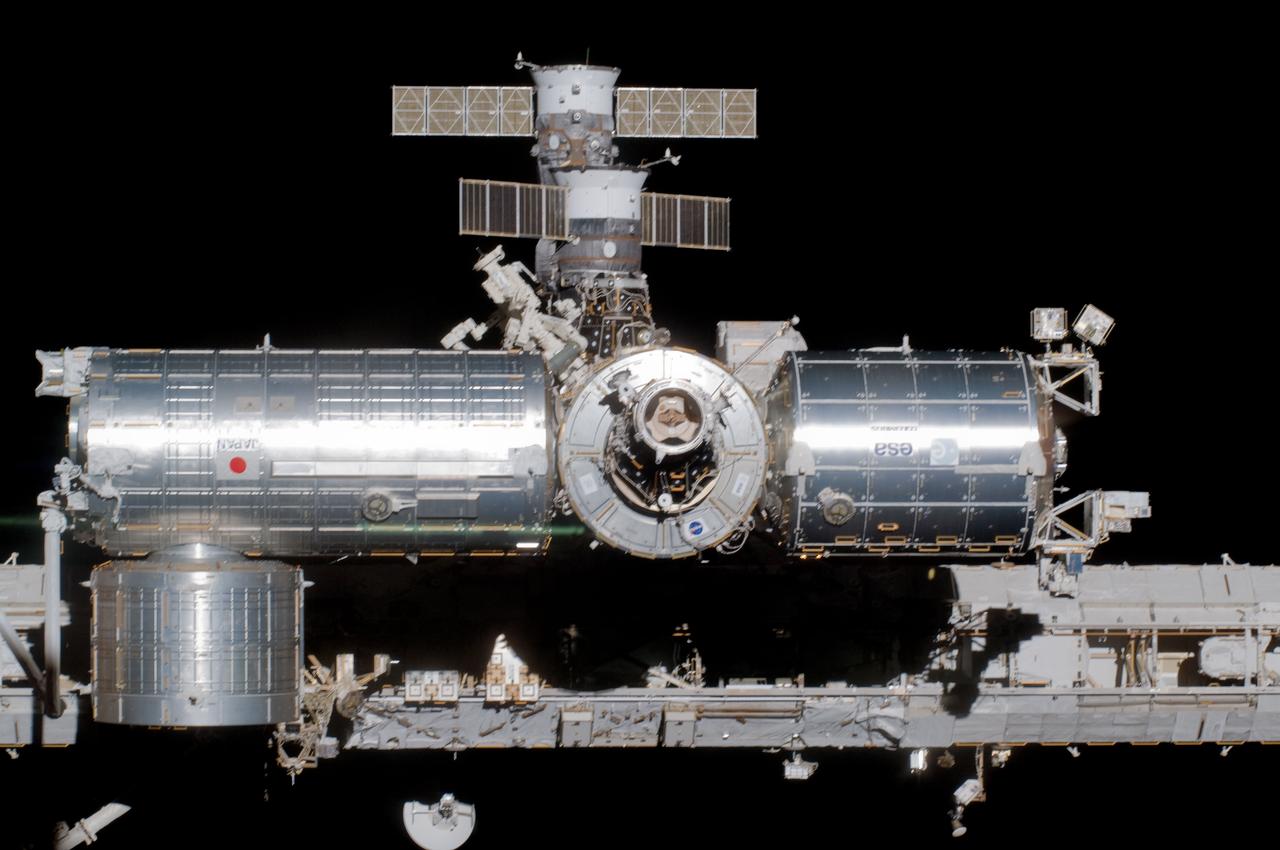 S124-E-010186 (11 June 2008) --- The newly installed Kibo laboratory (center left) attached to the port side of the Harmony node of the International Space Station is photographed from Space Shuttle Discovery as the two spacecraft begin their relative separation. The Kibo logistics module is visible at bottom left. The Columbus laboratory is at center right and the Canadian-built Dextre is at center top, along with two Russian spacecrafts docked with the station. Earlier the STS-124 and Expedition 17 crews concluded almost nine days of cooperative work onboard the shuttle and station. Undocking of the two spacecraft occurred at 6:42 a.m. (CDT) on June 11, 2008.