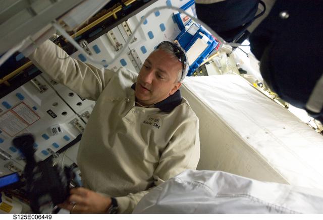 Massimino in the Shuttle Middeck