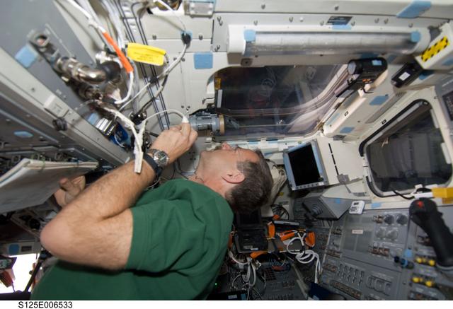 NASA image: Altman working on the Shuttle Atlantis Flight Deck