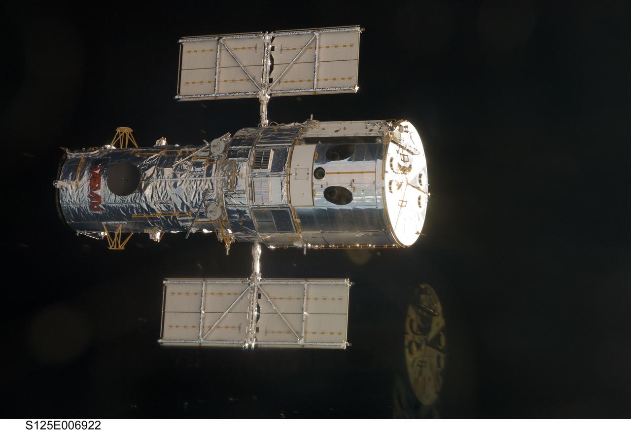 S125-E-006928 (13 May 2009)  --- An STS-125 crewmember onboard the Space Shuttle Atlantis snapped a still photo of the Hubble Space Telescope as the two spacecraft approached each other in Earth orbit prior to the capture  of the giant observatory.