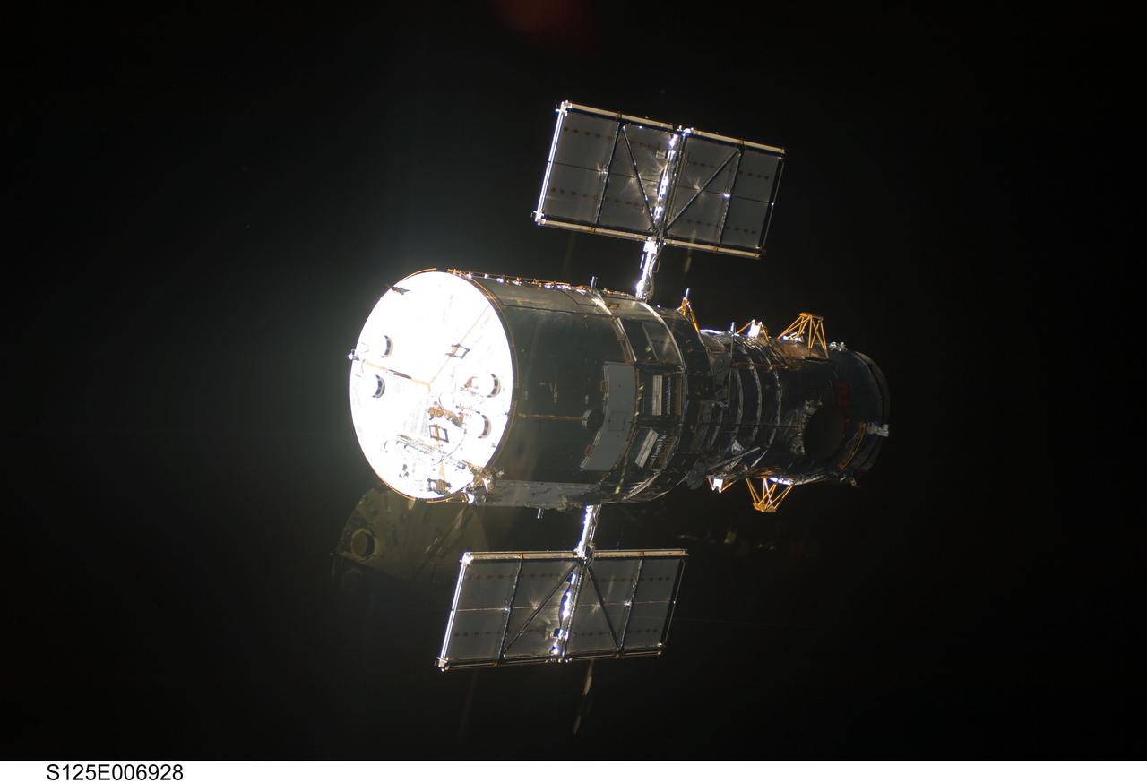 S125-E-006928 (13 May 2009)  --- An STS-125 crewmember onboard the Space Shuttle Atlantis snapped a series of still photo of the Hubble Space Telescope as the two spacecraft approached each other in Earth orbit prior to the capture  of the giant observatory.