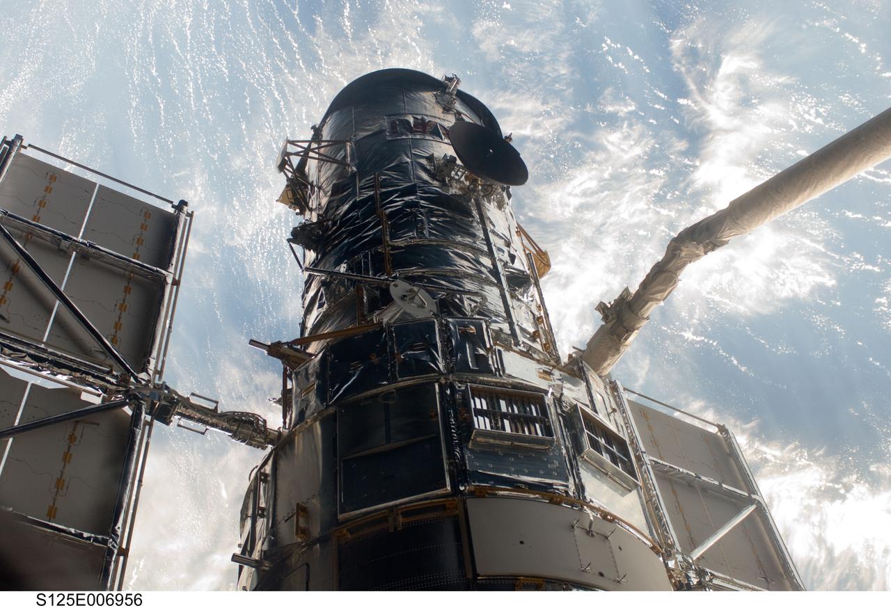 S125-E-006956 (13 May 2009) ---  An STS-125 crewmember onboard the Space Shuttle Atlantis snapped a still photo of the Hubble Space Telescope following grapple of the giant observatory by the shuttle?s Canadian-built remote manipulator system.