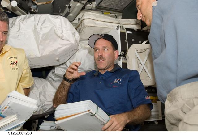 NASA image: STS-125 Crew Members in the Middeck during Flight Day 3