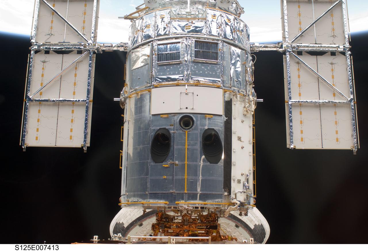 View of the HST docked with the Space Shuttle Atlantis