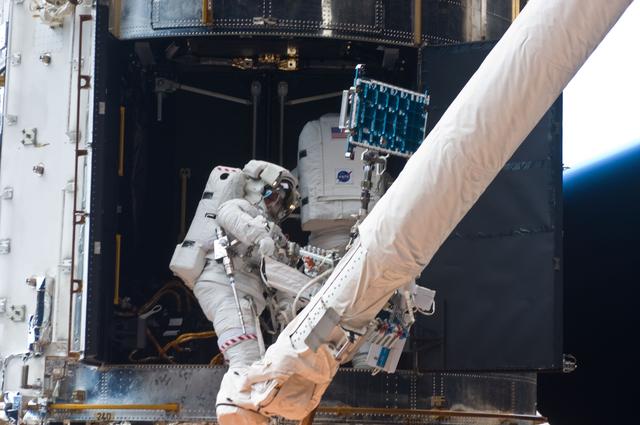 NASA image: STS-125 MS1 Good and MS4 Massimino during EVA4