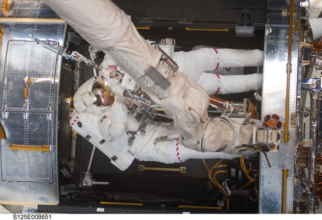 NASA image: STS-125 MS1 Good and MS4 Massimino during EVA4