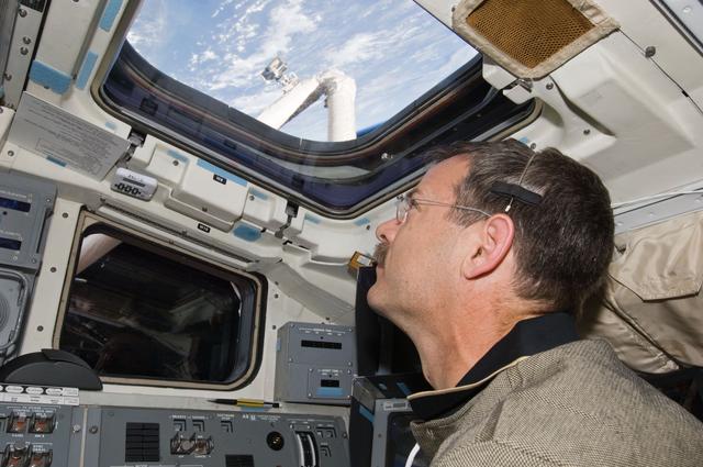 NASA image: STS-125 CDR Scott Altman works on the Atlantis Flight Deck