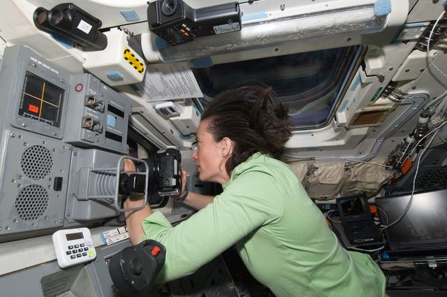 NASA image: View of STS-125 MS2 Megan McArthur on the Atlantis Flight Deck during Flight Day 7