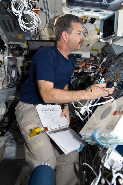 NASA image: STS-125 CDR Altman working on the Flight Deck