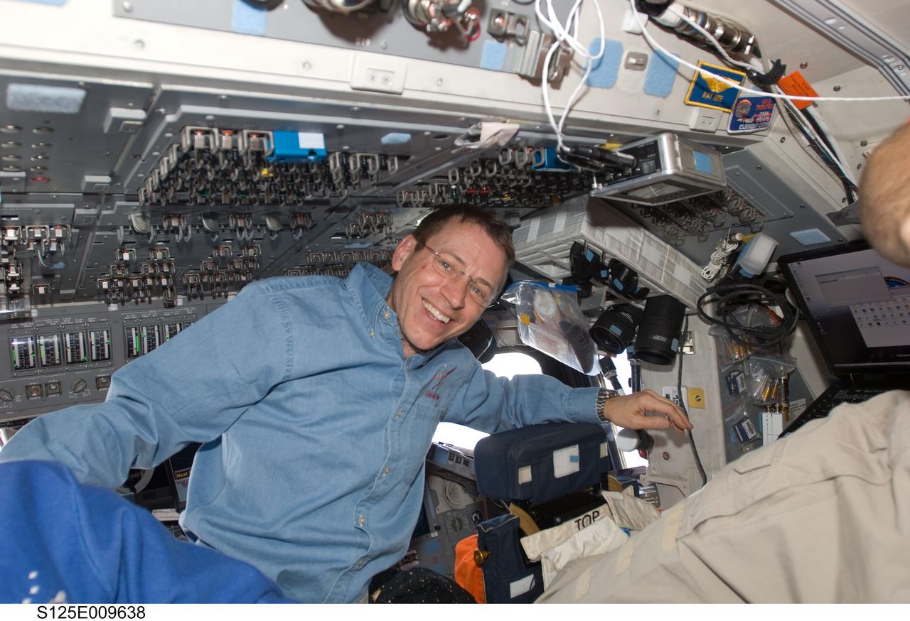 S125-E-009638 (18 May 2009) --- Astronaut Gregory C. Johnson, STS-125 pilot, is pictured on the flight deck of the Earth-orbiting Space Shuttle Atlantis during flight day eight activities.