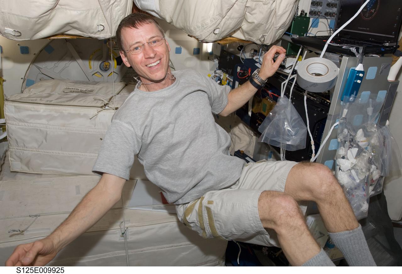 S125-E-009925 (18 May 2009) --- Astronaut Gregory C. Johnson, STS-125 pilot, is pictured on the middeck of the Earth-orbiting Space Shuttle Atlantis during flight day eight activities.